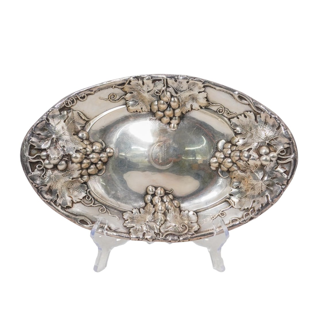 Mauser Co. Sterling Harvest Grapes Bowl: Mauser Co. Sterling Harvest Grapes Bowl 1887-1903, American A sterling silver serving bowl with harvest grapevine motifs throughout border by Mauser Manufacturing Company (established 1887, American).