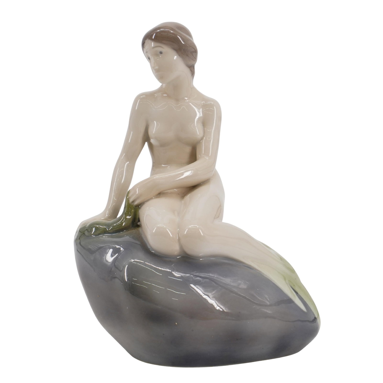 Royal Copenhagen "The Little Mermaid" Porcelain Figurine: Royal Copenhagen "The Little Mermaid" Porcelain Figurine 20th Century, Denmark A Royal Copenhagen "The Little Mermaid" glazed porcelain figurine, by: Edvard Eriksen. The Danish statue of the "Little M