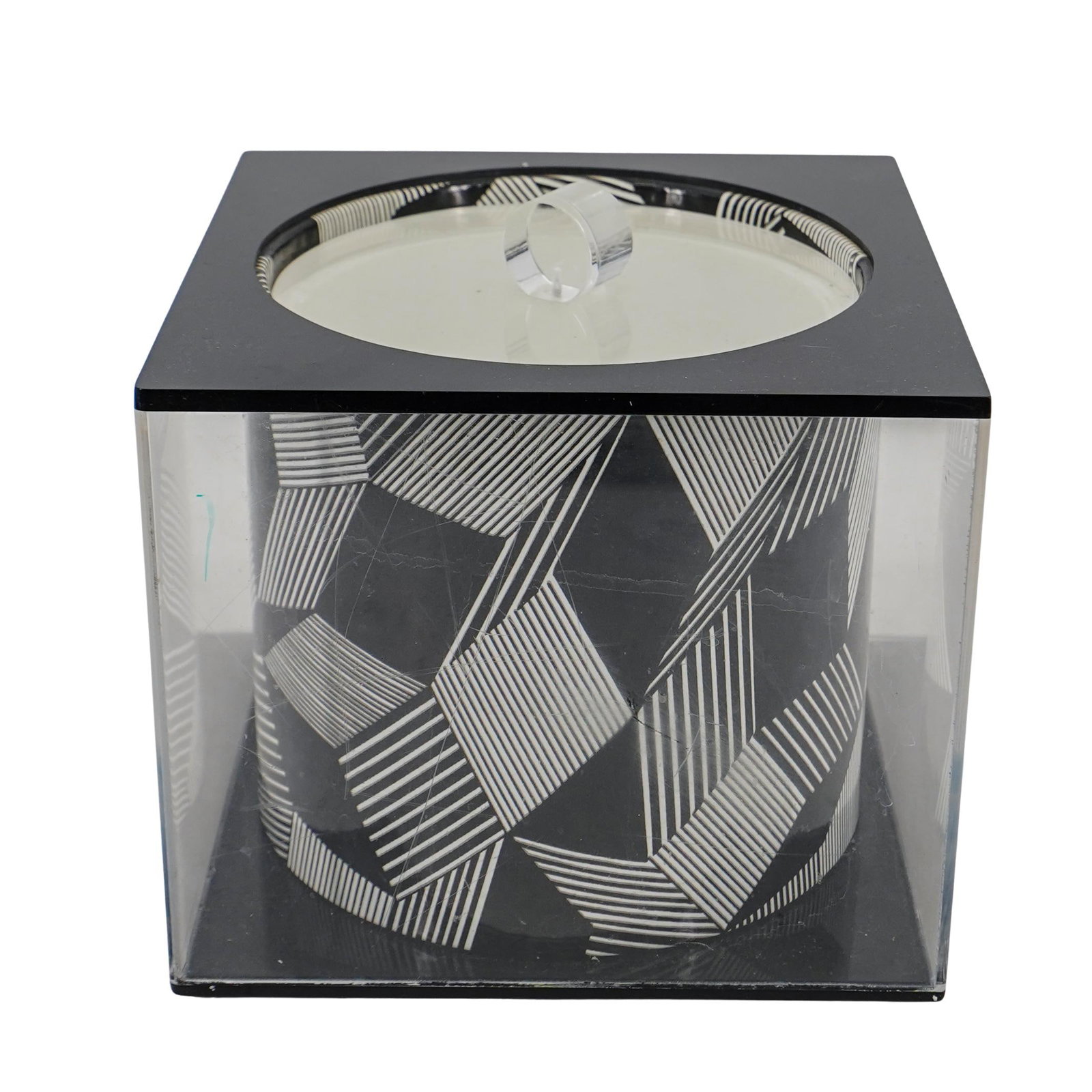 MCM Tayco Op-Art Ice Bucket: MCM Tayco Op-Art Ice BucketMid 20th century, AmericanA mid 20th century ice bucket featuring a black and white optical art designed ice bucket with an acrylic body and lid. Marked on bottom with stick