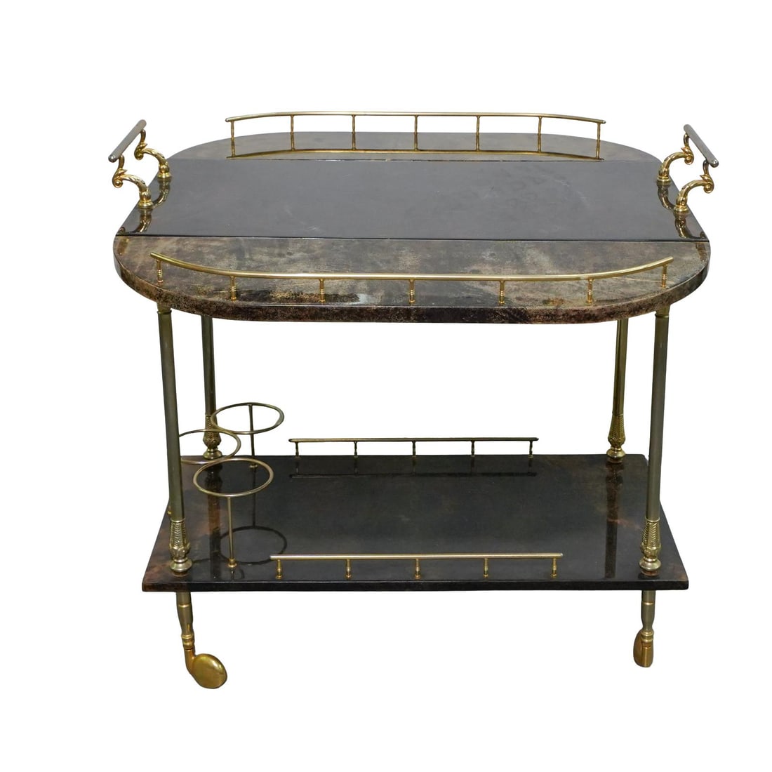 Aldo Tura (1909-1963) Goat Skin Bar Cart: Aldo Tura (1909-1963) Goat Skin Bar Cart1960s, ItalyA lacquered goat skin bar cart with gilt hardware throughout. Marked with "TURA" label associated with Italian designer Aldo Tura (b. 1909 d. 1963).