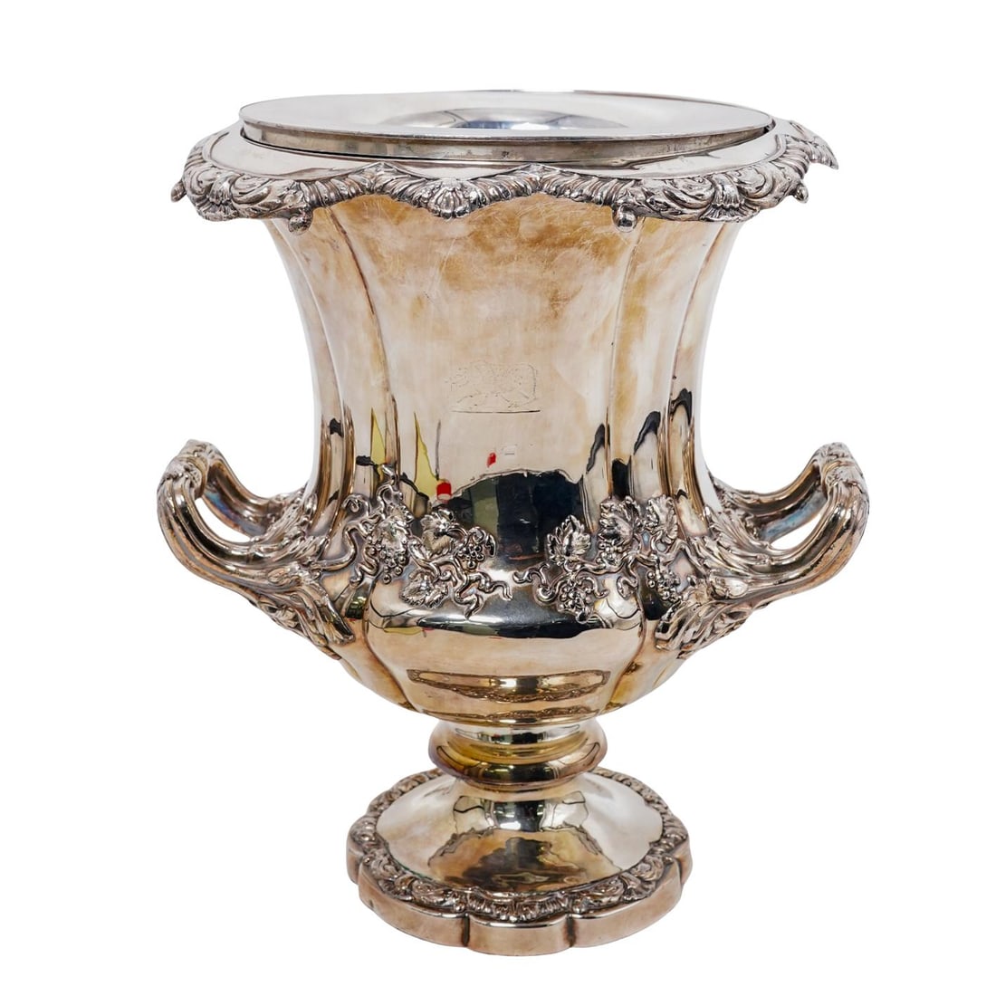 Late Georgian Sheffield Plate Wine Cooler: Late Georgian Sheffield Plate Wine Cooler19th Century, ContinentalLate Georgian silver plate wine cooler with trophy cup handled design, embellished with robust grape-and-grapeleaf intertwined decorat