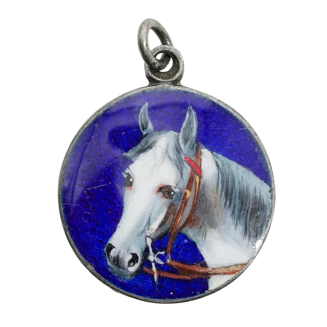935 Silver Enamaled Horse Pendant: 935 Silver Enamaled Horse Pendant 935 silver pendant, featuring a hand painted enameled white horse painted on the front. Hallmarked "935 S.M." Total weight: 4.22g D: 1"