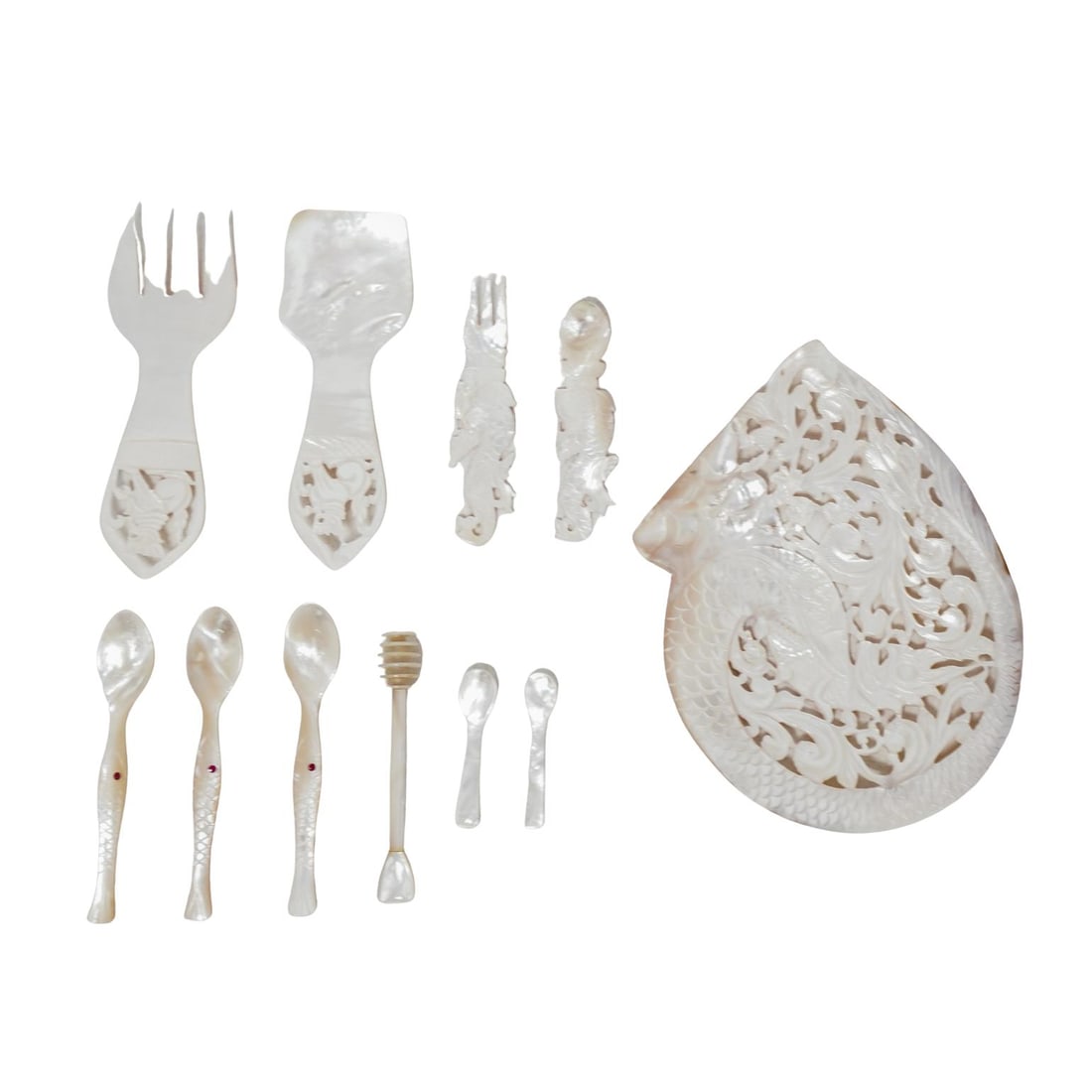 (11 Pc) Exquisite Carved Mother of Pearl Tasting Service: (11 Pc) Exquisite Carved Mother of Pearl Tasting Service20th c., AsiaHighly detailed carved mother of pearl utensils and decorative openwork plate.(Smallest) L: 2.75" W: 0.55"(Largest) L: 8.75" W: 7"