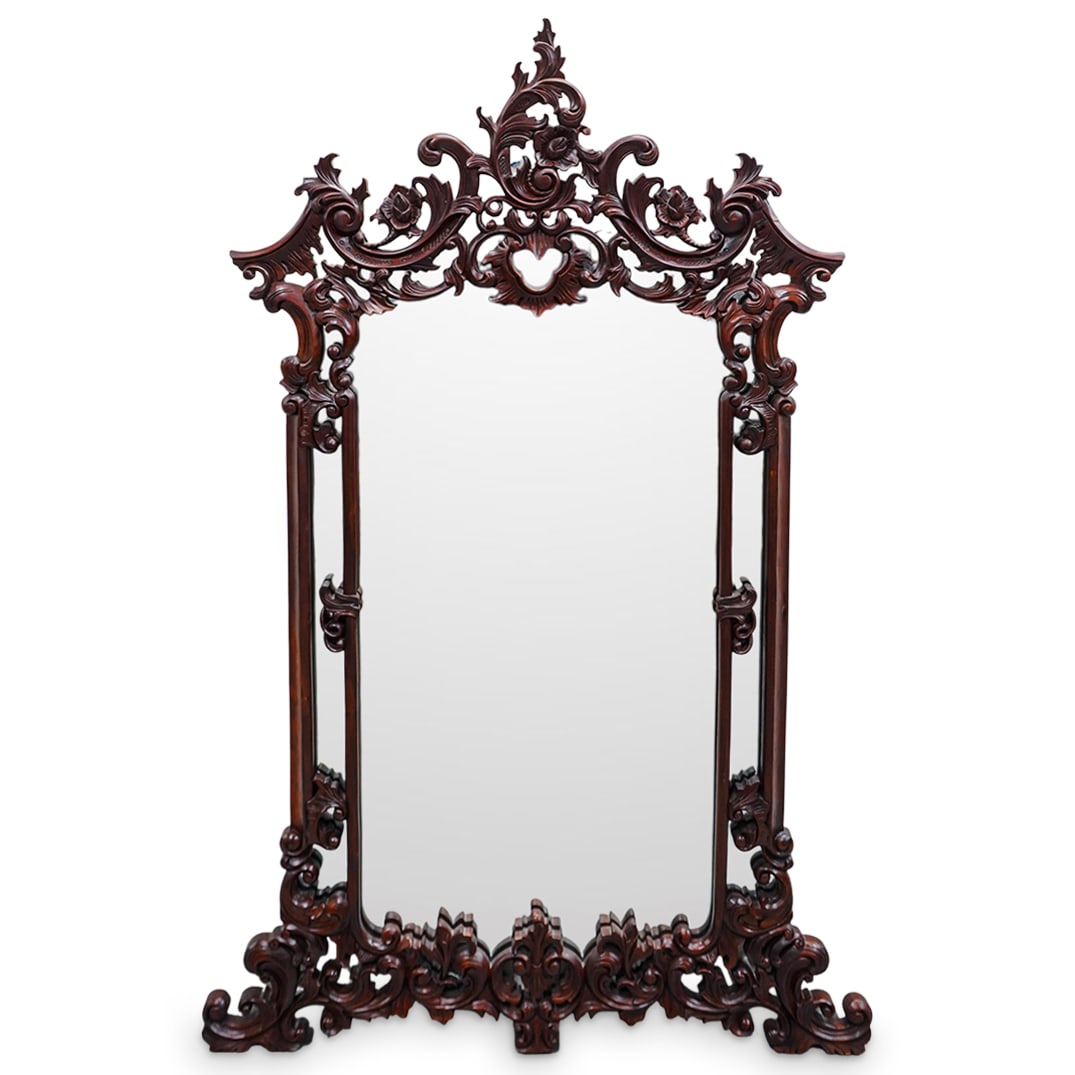 Floral Carved Wood Mirror: Floral Carved Wood Mirror Early 20th century, Continental A carved wood mirror with a decorative floral design throughout frame. Parts of the design near edges are open cut as to allow the mirror to s