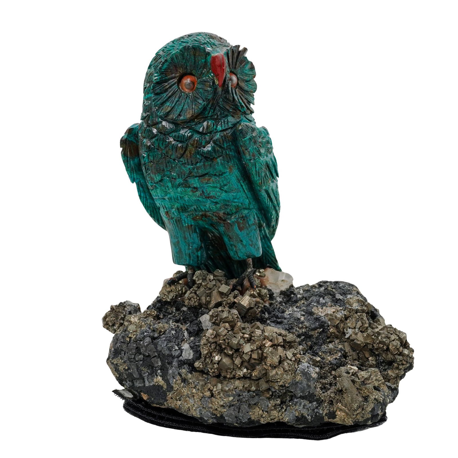 Carved Malachite Owl Sculpture: Carved Malachite Owl SculptureCarved malachite owl sculpture, perched atop a natural mineral base.H: 8" W: 5" L: 7.25"