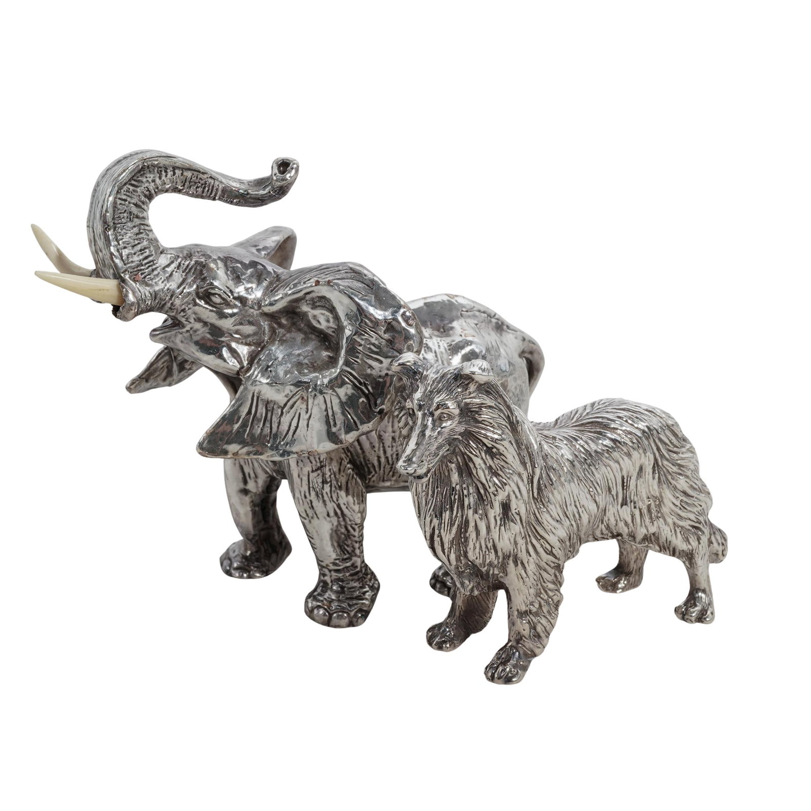 (2 pcs) Signed Sterling Silver Elephant and Collie Dog Figurines: (2 pcs) Signed Sterling Silver Elephant and Collie Dog Figurines 20th century, Continental A grouping of two sterling silver figurines. Total weight: 266.6 grams. x1 Elephant. Carved bone tusks. Marke