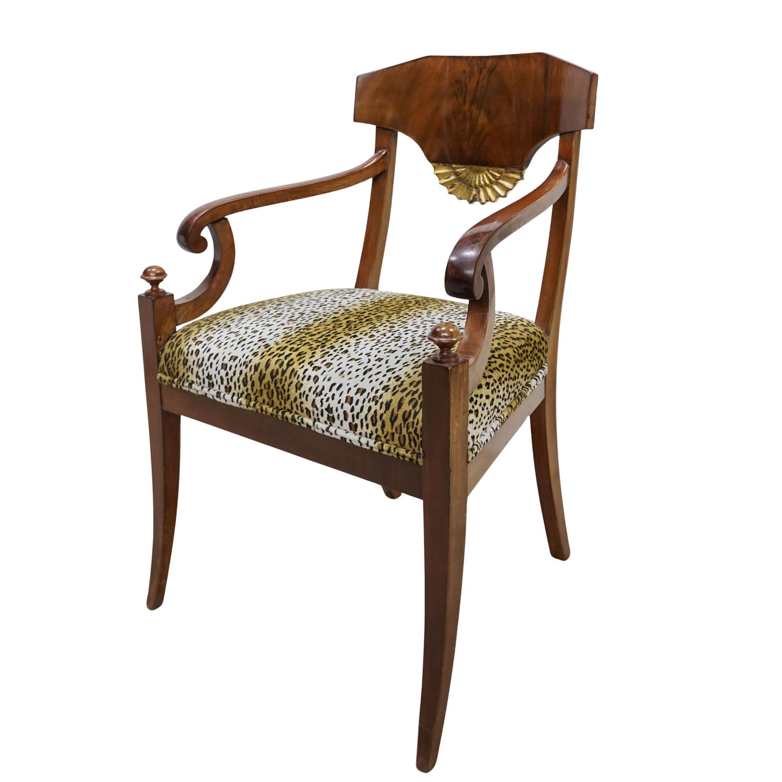 Antique Wood and Leopard Upholstered Chair: Antique Wood and Leopard Upholstered Chair20th cent, EuropeanAntique carved wood and leopard upholstered arm chair w/ semi starburst gilt carvingH: 35” W :23.5” D: 22”