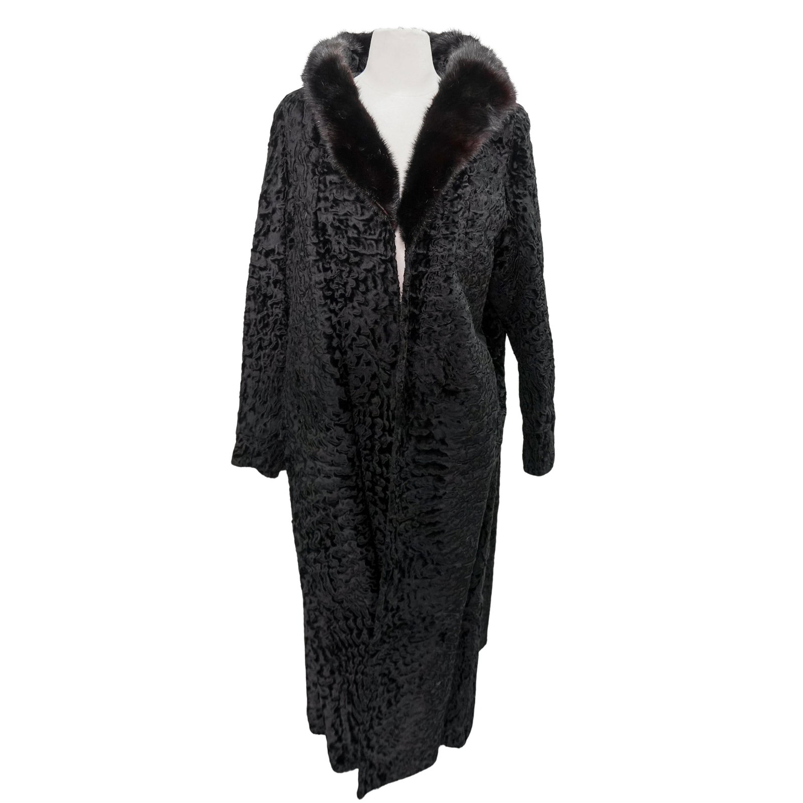 Black Astrakhan Coat With Mink Fur Collar: Black Astrakhan Coat With Mink Fur Collar 20th Century, American. Vintage black astrakhan coat with mink fur collar. With frontal hidden closure snaps and lateral pockets. With sewn-in 'Bonwit Teller'