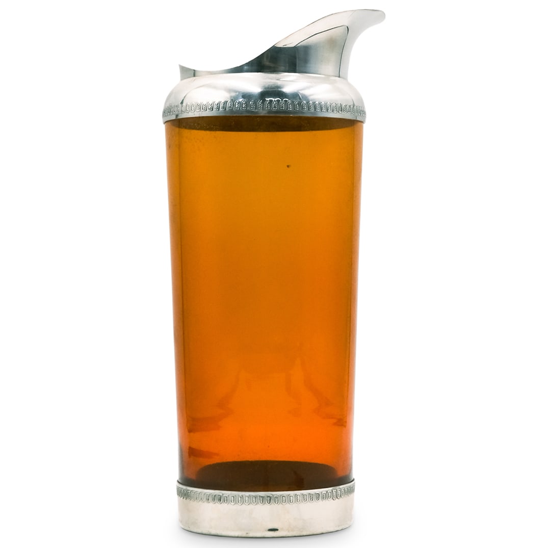 Metawa Holland Pewter & Amber Glass Carafe: Metawa Holland Pewter & Amber Glass CarafeHolland, 20th centuryMetawa (established 1923, Holland) pewter and amber colored glass carafe. Marked on bottom with hallmark and reading "Metawa Holland real