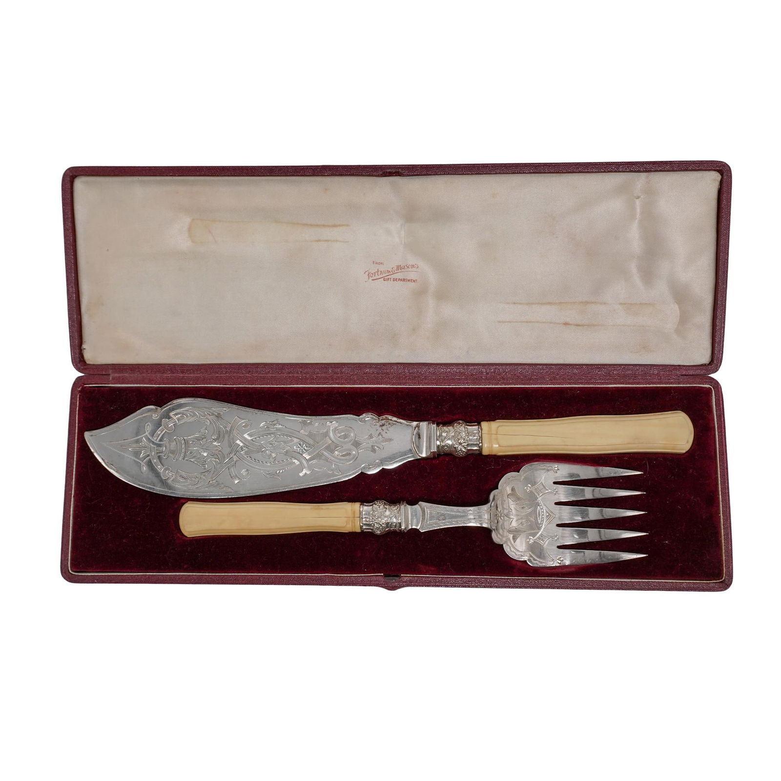 Pair of Bone Handled Silver Plated Serving Utensils: Pair of Bone Handled Silver Plated Serving UtensilsEarly 20th century, EnglishA set of bone handled and silver-plated serving utensils complete of one fork and one knife with decorative engravings. Bo