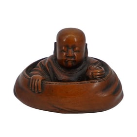 Japanese Boxwood Netsuke off Hotei in Bag with Finley Carved Design to Robe Holding spir pearl in