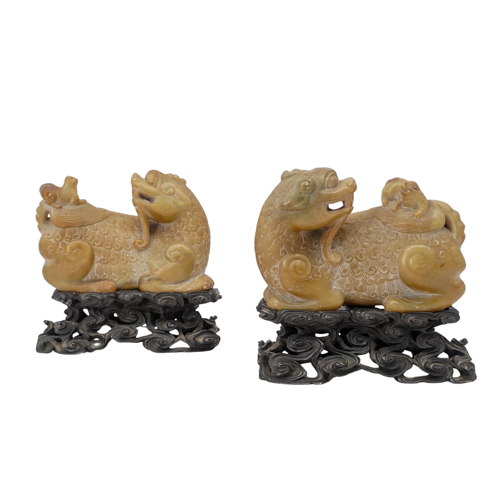 Pair Of Chinese Soapstone Chilong, Buddhist Lions: Pair Of Chinese Soapstone Chilong, Buddhist Lions18th to19th CenturyThis very unusual, beautifully carved pair of Buddhist lions feature single horns to their heads, finely carved curly hair, clawed f