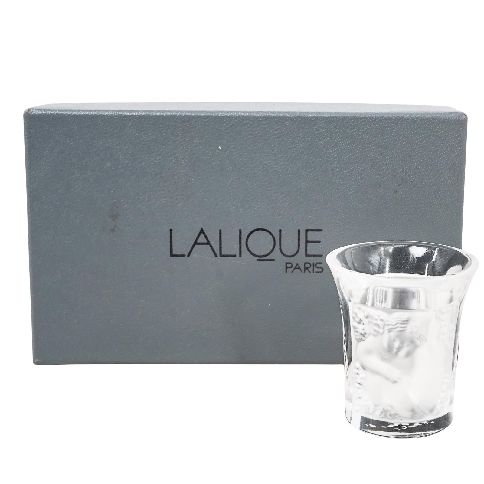 Lalique Figural "Enfants" Shot Glass: Lalique Figural "Enfants" Shot Glass Late 20th-21st century, French One Lalique "Enfants" shot glass featuring a frosted crystal relief of two cherub like figures. Marked "Lalique France" on bottom. O