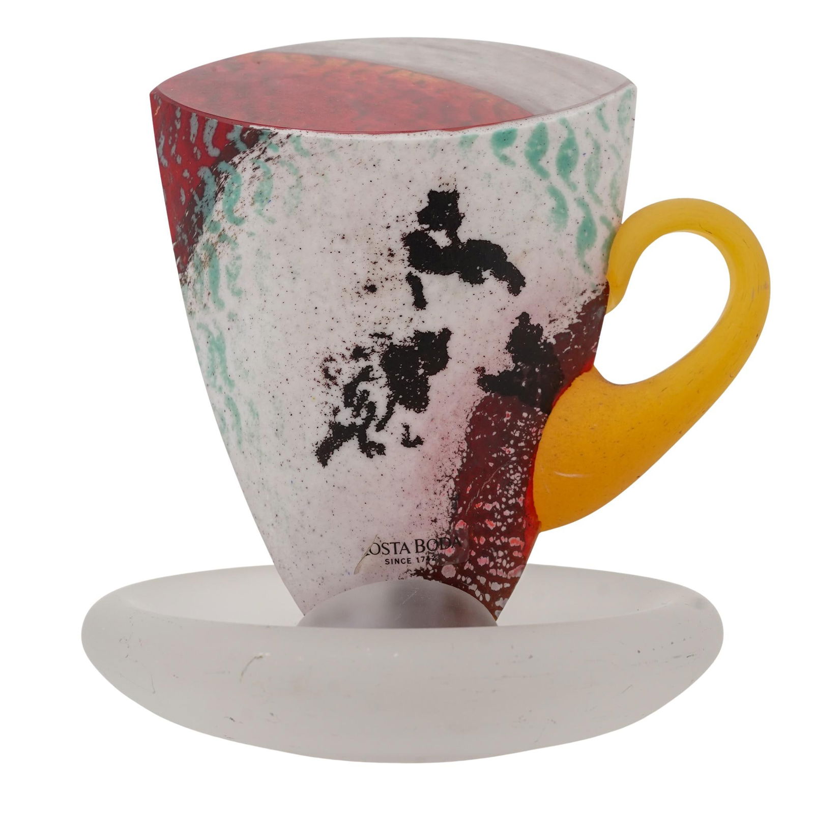 Kjell Engman for Kosta Boda, Abstract Glass Cup: Kjell Engman for Kosta Boda, Abstract Glass Cup20th Cent., SwedenKosta Boda frosted art glass cup and saucer, designed by Kjell Engman. Featuring an abstract design and yellow mug handle. Acid etched