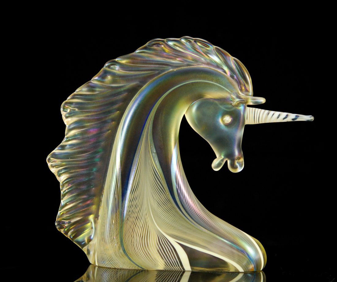 Stuart Abelman art glass unicorn bust. Signed: DESCRIPTION: Stuart Abelman art glass unicorn bust. Art glass depiction of a unicorn head. Abstract iridescent flowing lines from the base to the head. Exaggerated mane with an iridescent sheen to the