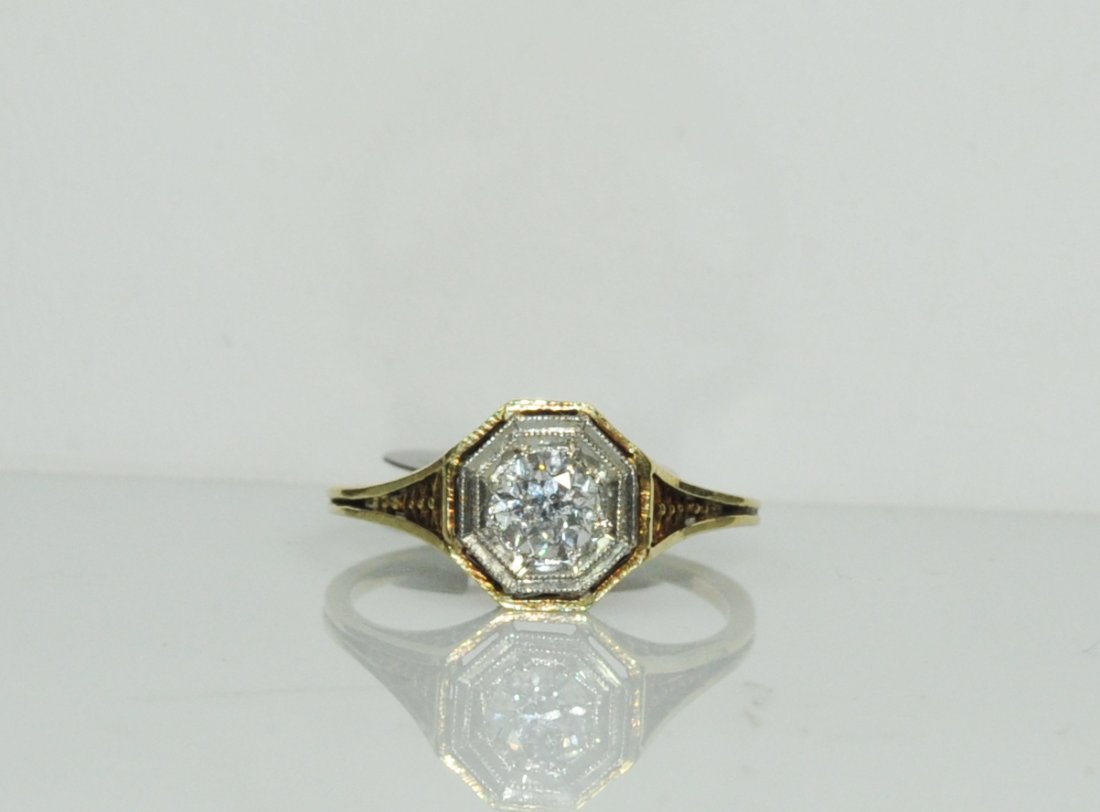 Vintage 0.50ct solitaire and 14k ladies ring: DESCRIPTION: Vintage 0.50ct solitaire and 14k ladies ring. 14k yellow gold filigree design with a center 0.50ct round brilliant diamond (Clean and white) bordered by a 14k white gold bezel. Gorgeous s