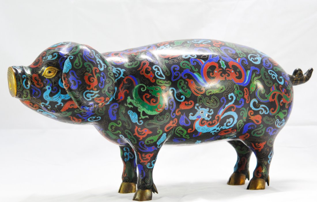 Large Chinese Cloisonne over copper pig statue: DESCRIPTION: Large Chinese Cloisonne over copper pig statue. Large copper pig done in cloisonne throughout the entire piece. Features a wucai color theme with a black ground color. Multi colored drago
