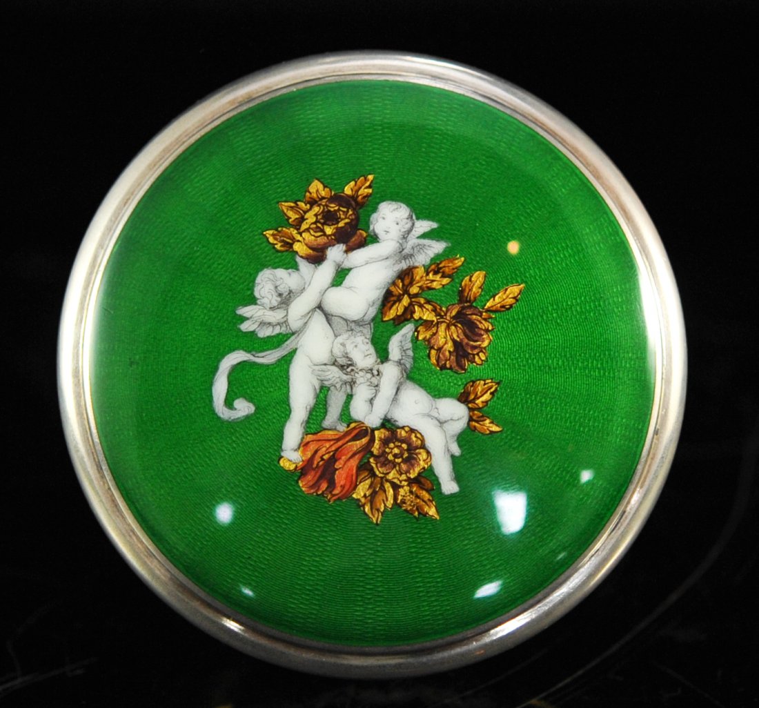 Antique Austrian enamel and moser glass box: DESCRIPTION: Antique Austrian enamel and moser glass box. Lime green Moser glass body decorated with a foliate gold leaf design wrapped around the entire piece. The lid is made from sterling featuring