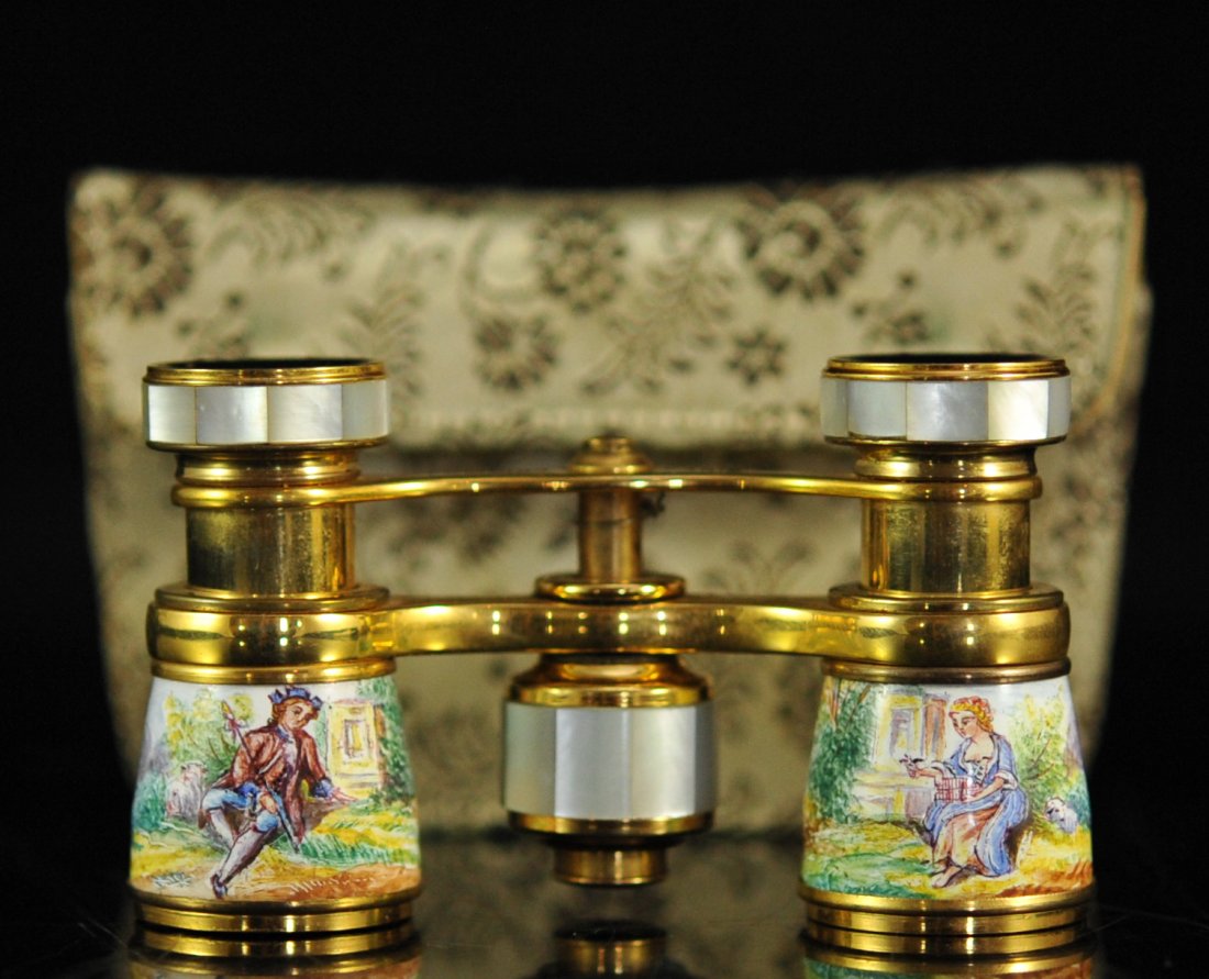 French mother of pearl and painted porcelain binoculars: DESCRIPTION: French mother of pearl and painted porcelain binoculars. Features two gorgeous hand painted scenes on porcelain around both lenses of a man and woman sitting on the grass surrounded by Fr
