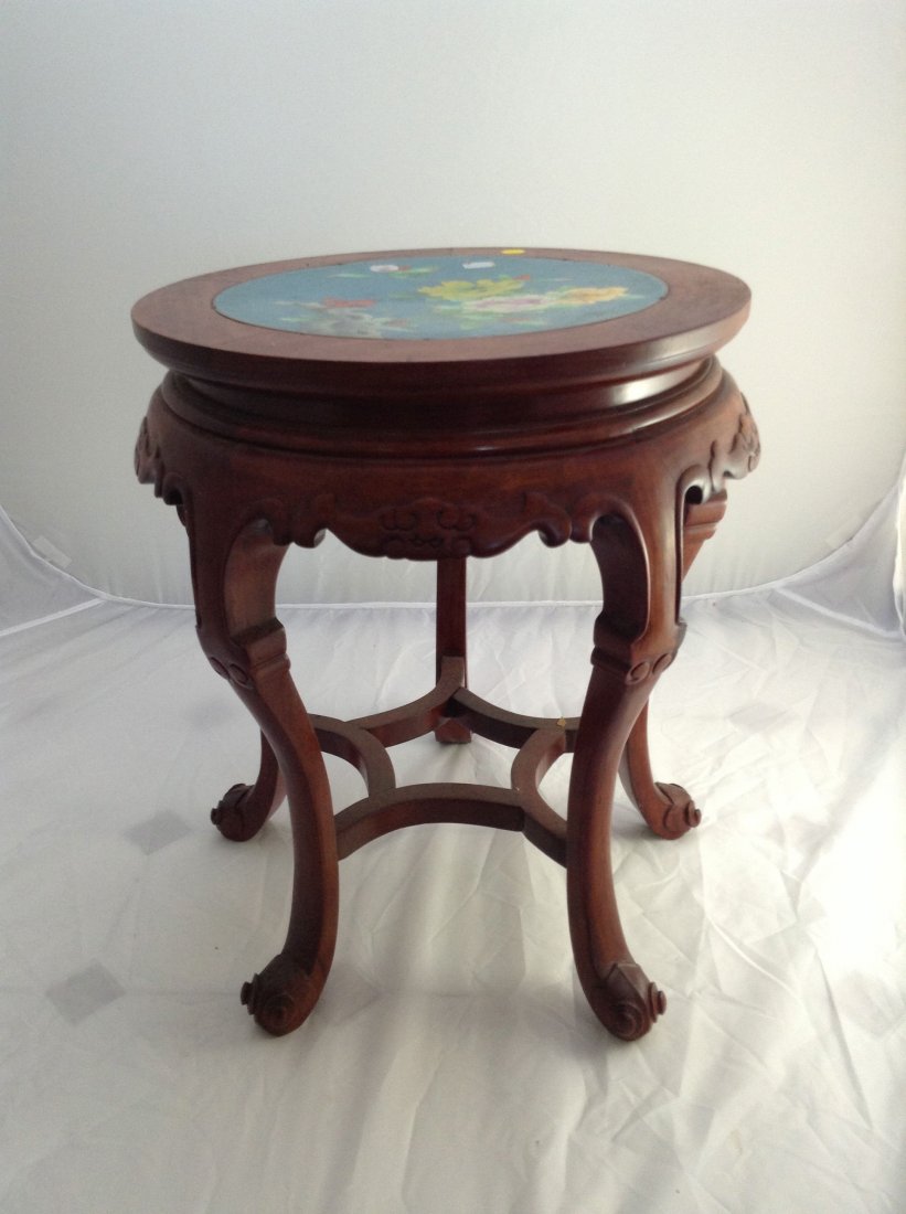 Antique Chinese rosewood and cloisonne table: DESCRIPTION: Antique Chinese rosewood and cloisonne table. Solid hand carved rosewood body with a large cloisonne over copper center plaque. Turquoise base color accented with marigold and violet peon