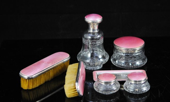 Udall and Ballou French enamel dresser set.: DESCRIPTION: Udall and Ballou French enamel dresser set. Features seven pieces made from sterling, rose engine turned enamel (Guilloche), and crystal. The set contains two hair brushes, two makeup jar