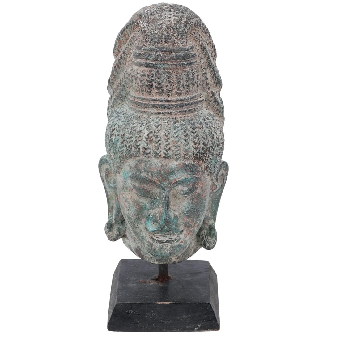Antique Khmer Bronze Head Sculpture: Antique Khmer Bronze Head SculptureLate 19th-early 20th century, Southeast AsiaAntique Khmer bronze head sculpture on a black wooden base. Wooden support inside.H 8 1/4" W 3" L 3 1/8" Base W 2 3/4"