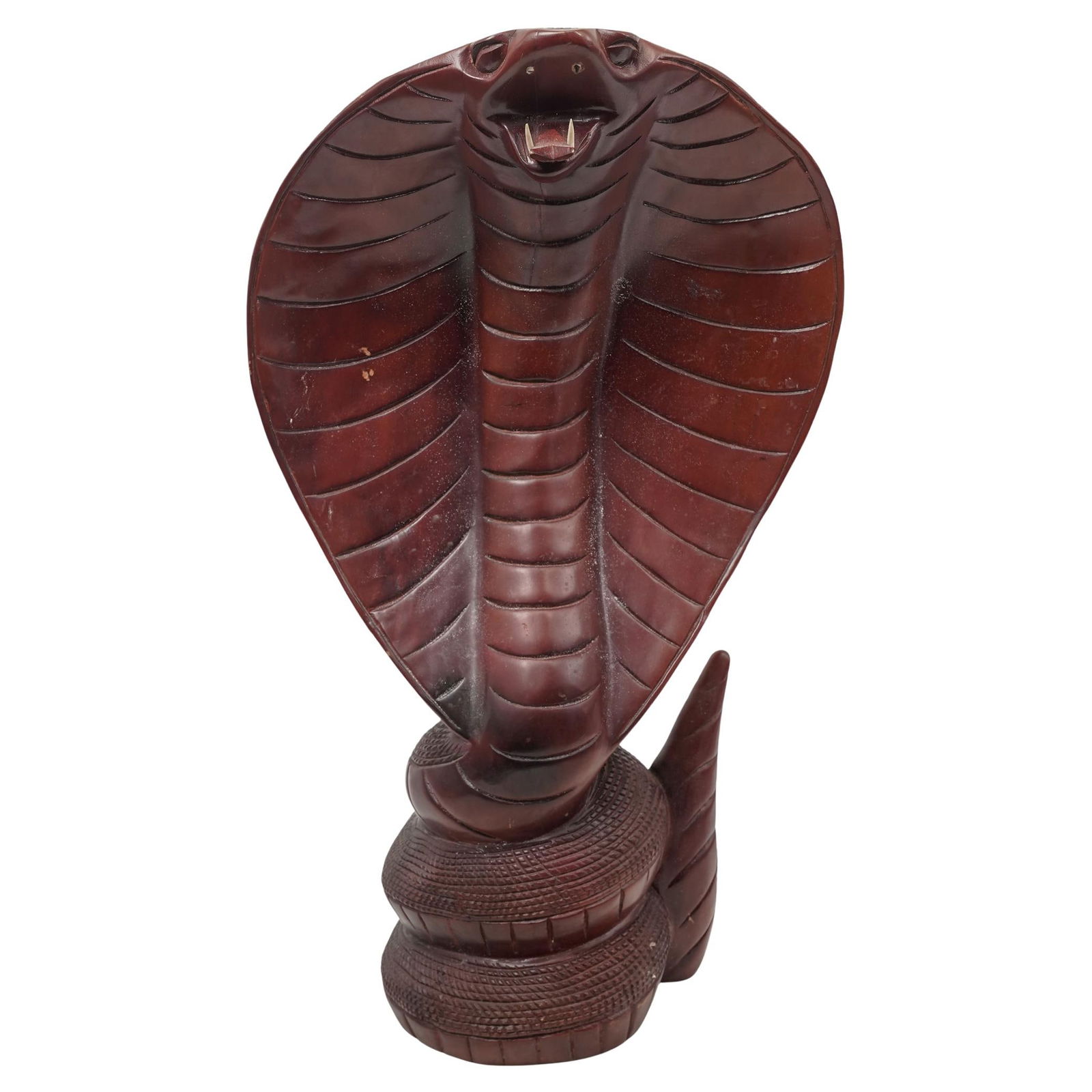 Monumental Wooden King Cobra Sculpture: Monumental Wooden King Cobra Sculpture20th century, ContinentalA monumental intricately carved red and black lacquered wooden sculpture of a king cobra with carved bone fangs.H 23 1/2" W (bottom) 8" W
