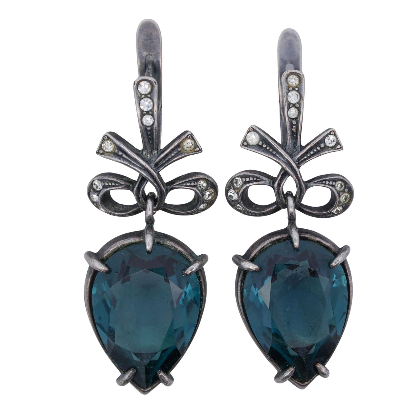 Jenavi Russian Silver & Blue Swarovski Crystal Earrings: Jenavi Russian Silver & Blue Swarovski Crystal Earrings21st c., RussiaNielloed silver bow drop earrings with large blue teardrop Swarovski crystals and small clear accent crystals. Jenavi and Russian