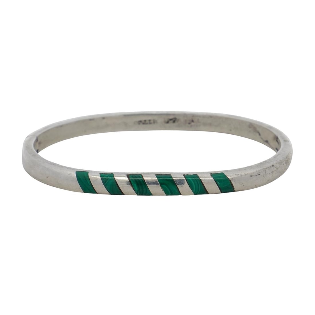Mexican Sterling Silver and Malachite Bracelet: Mexican Sterling Silver and Malachite Bracelet20th c., MexicoHinged sterling silver bracelet with inlaid malachite. It is hallmarked Mexico P-20 925 on the inside. 24.2g total weight.L: 2.5" W: 2"