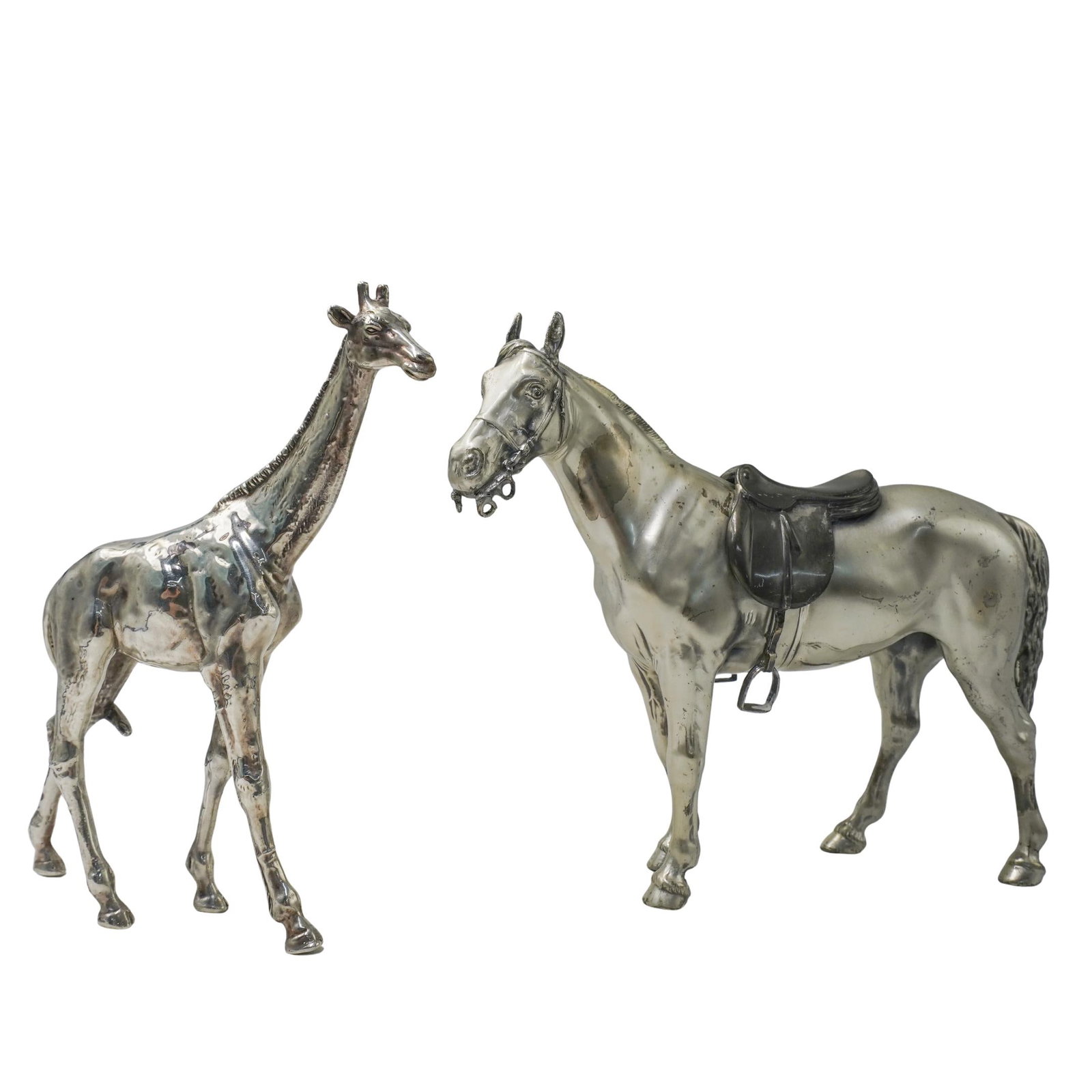 (2 Pc) 800 Silver Giraffe & Silverplate Horse Figurines: (2 Pc) 800 Silver Giraffe & Silverplate Horse Figurines 20th Century. (2 Pc) A 800 Silver giraffe and Silverplate Horse animal figurines. Includes: (1 Pc) 800 silver horse hollowware giraffe figurine,
