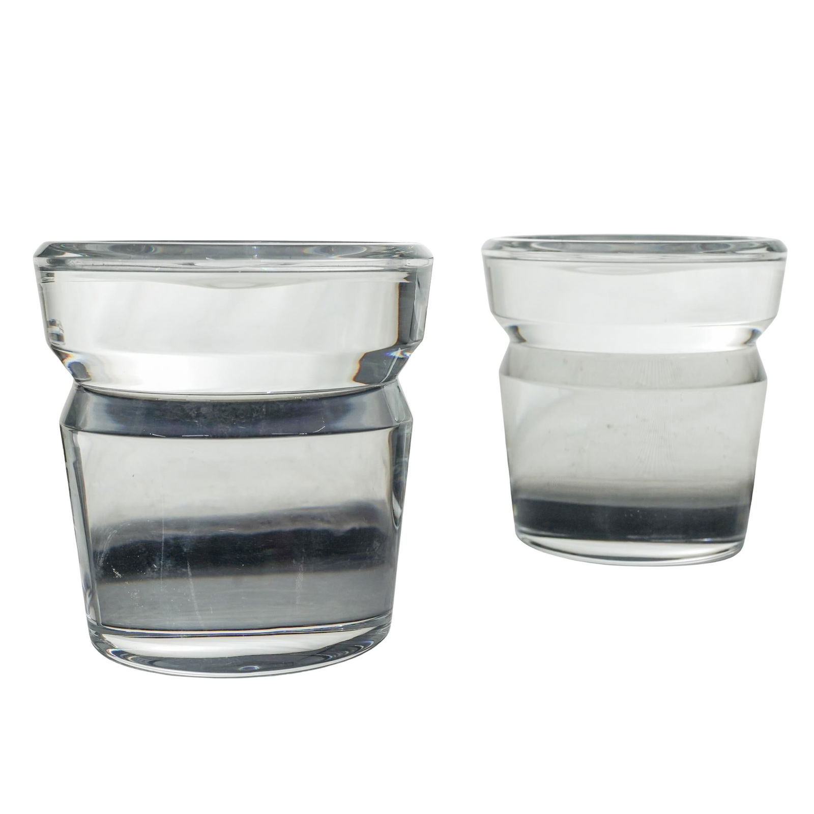 Pair of Steuben Candle Pillar Stands: Pair of Steuben Candle Pillar Stands20th century, AmericanA pair of Steuben (established 1903, American) candle pillar stands. Marked with etched "Steuben" on base rim.H 3 7/8" Diameter 3 7/8"