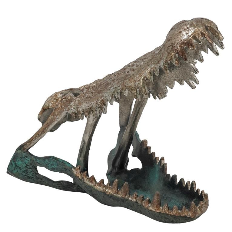 Modernist Metal Alligator Skull Sculpture: Modernist Metal Alligator Skull Sculpture 20th-21st c., Continental Metal gator skull with a rusted chrome finish on the upper jaw and bottom row of teeth and verdigris lower jaw. H: 12" W: 9.5" L: 14