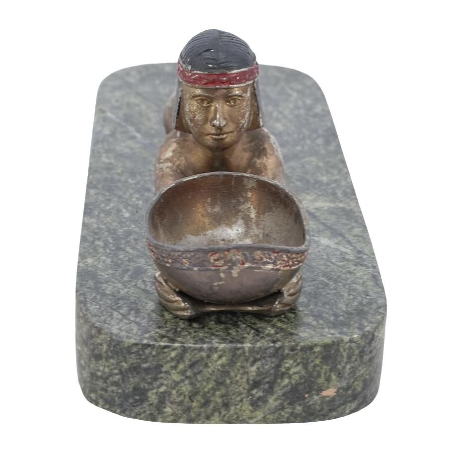 Egyptian Revival Figural Incense Burner: Egyptian Revival Figural Incense Burner 20th century, Continental An Egyptian Revival metal figural incense burner depicting a nude figure laying down holding a bowl. Affixed to a green marble slab. F