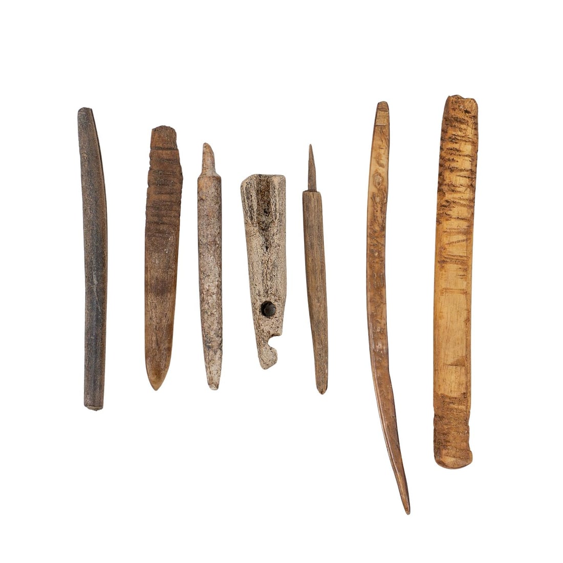 (7 pcs) Native North American Carved Bone Tools: (7 pcs) Native North American Carved Bone ToolsLate 19th-20th century, North American ContinentA set of seven Native North American carved bone tools and artifacts.Smallest: L 2 1/4" Diameter 1/2" Lar