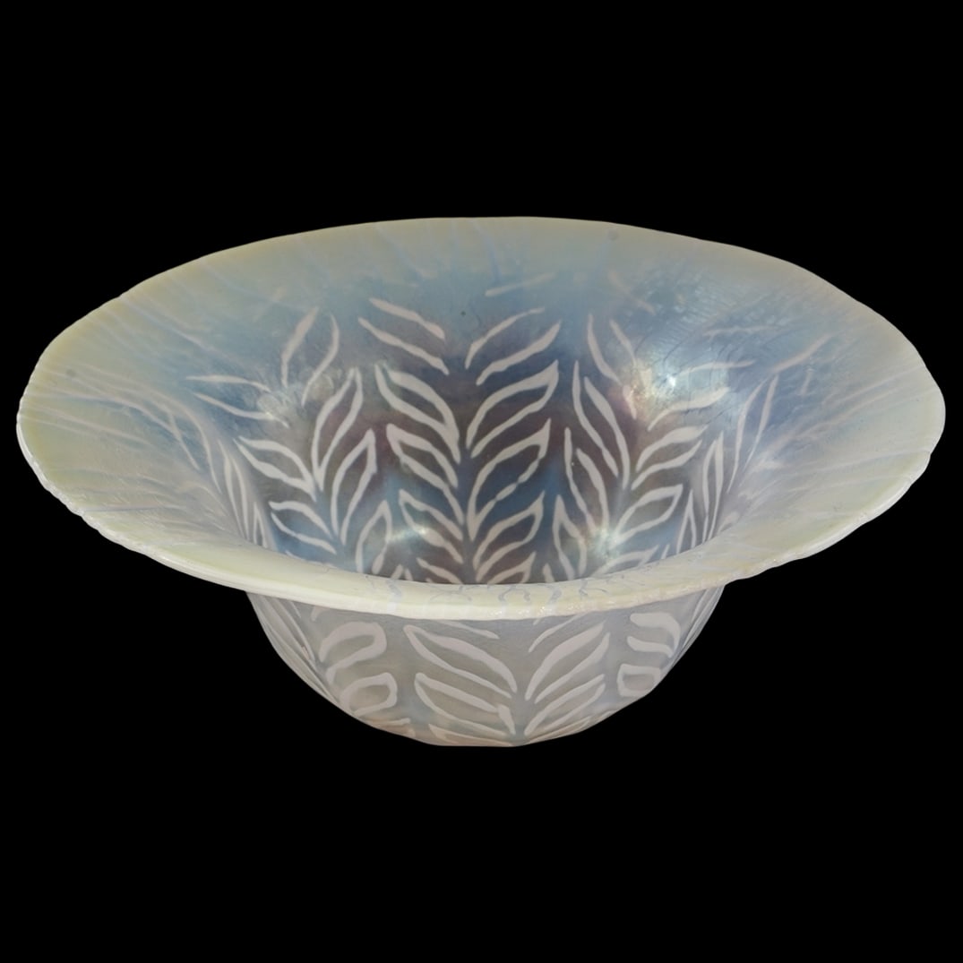 L.C. Tiffany Favrile Fern Leaf Bowl: L.C. Tiffany Favrile Fern Leaf Bowl1925, USALouis Comfort Tiffany opalescent favrile glass bowl decorated with a white stylized leaf pattern. It is signed "L.C. Tiffany Favrile 1925" on the underside.