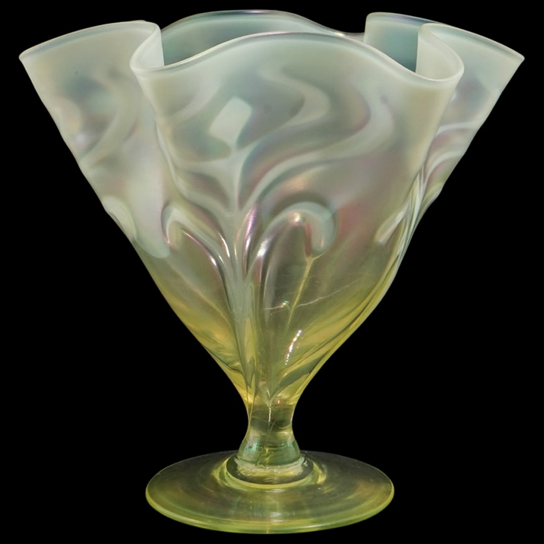 Loetz Austria Uranium Glass Handkerchief Vase: Loetz Austria Uranium Glass Handkerchief VaseLate 19th-early 20th century, AustriaLoetz (established 1850, Austrian) iridescent uranium glass handerkchief vase with a swirled design throughout. Marked