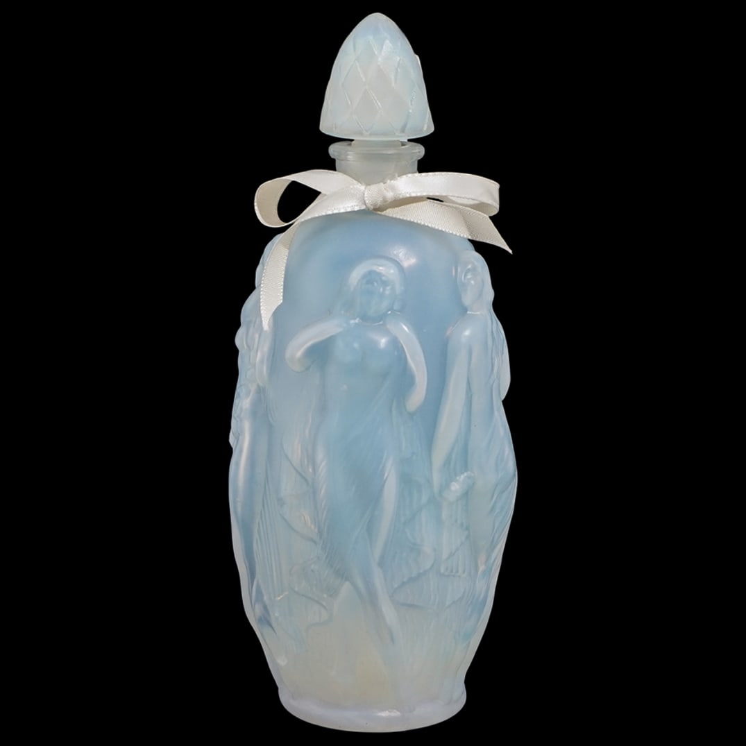 Sabino France "Gaite" Opalescent Glass Perfume Bottle: Sabino France "Gaite" Opalescent Glass Perfume Bottle20th c., FranceOpalescent glass perfume bottle featuring nude female reliefs with a thistle stopper. It is engraved "Sabino France" with a label on