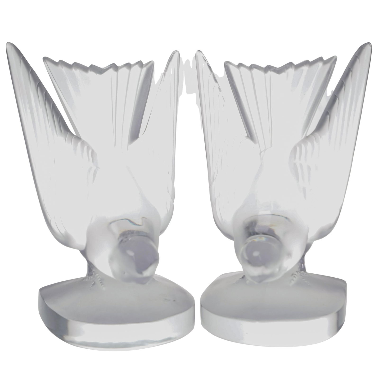 Pair of Lalique "Deux Hirondelles" Swallow Bookends: Pair of Lalique "Deux Hirondelles" Swallow Bookends20th c., FranceClear and frosted crystal bookends featuring swallow birds looking down. Lalique France mark on undersides.H: 6.25" W: 3" D: 3.5"