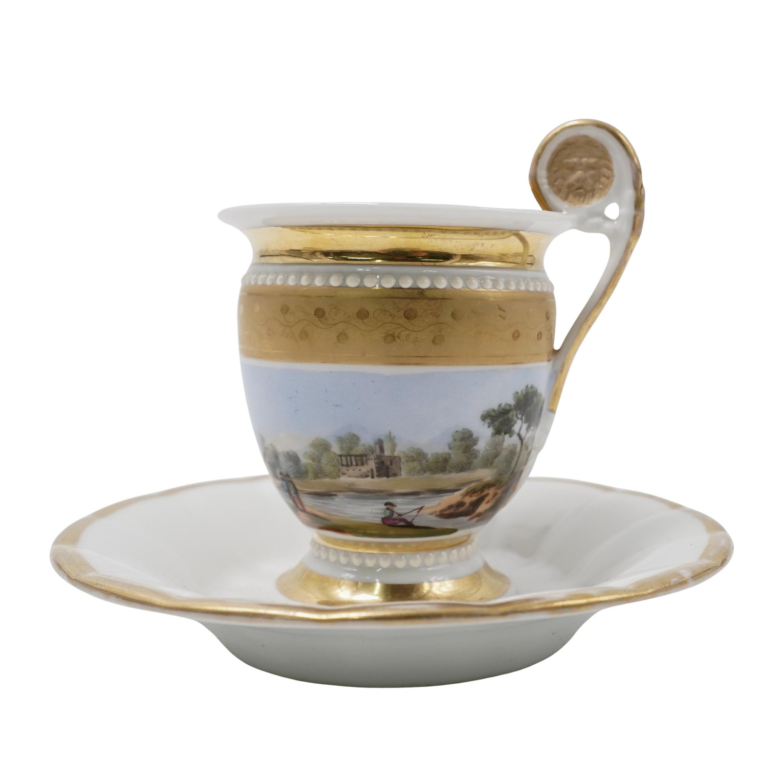 Russian Porcelain Demitasse Cup and Saucer: Russian Porcelain Demitasse Cup and Saucer 20th Cent. Russia A richly decorated with gilded details and a hand-painted landscape scene featuring figures and architecture in soft pastel tone.The cup ha