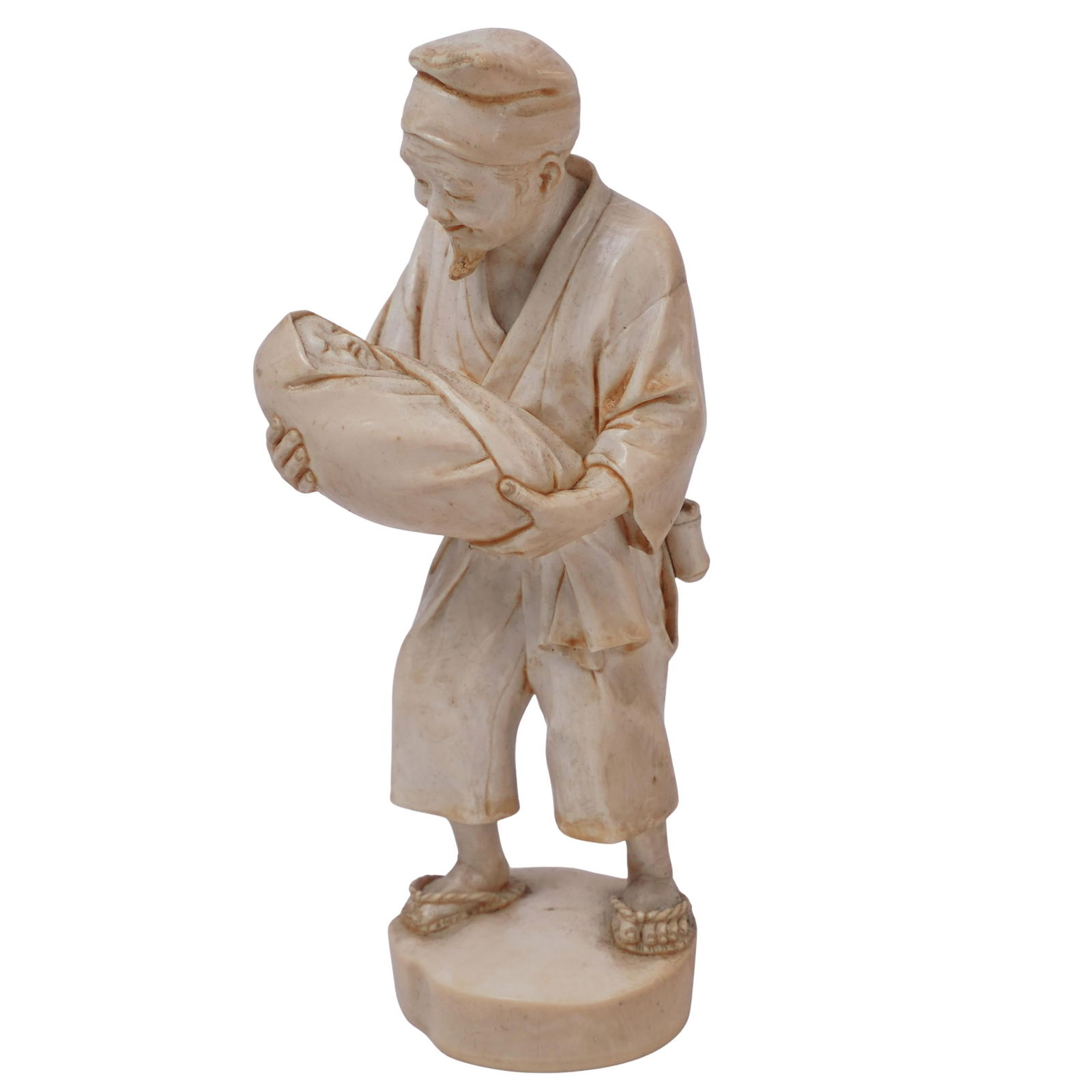 Signed Antique Japanese Man and Baby Carved Bone Okimono Figurine: Signed Antique Japanese Man and Baby Carved Bone Okimono Figurine20th c., JapanFinely detailed hand-carved figurine of a man holding a swaddled baby. It is signed on the underside of the base.H: 5.5"