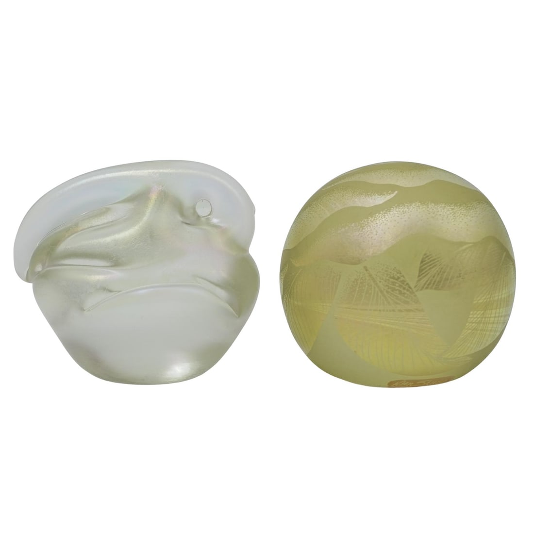 (2pc) Orient & Flume Iridescent Art Glass Paperweights: (2pc) Orient & Flume Iridescent Art Glass Paperweights20th Cent. USABeautiful pair of iridescent art glass paperweights, featuring rich luster and delicate coloration.Both are signed on the bottom.Fir