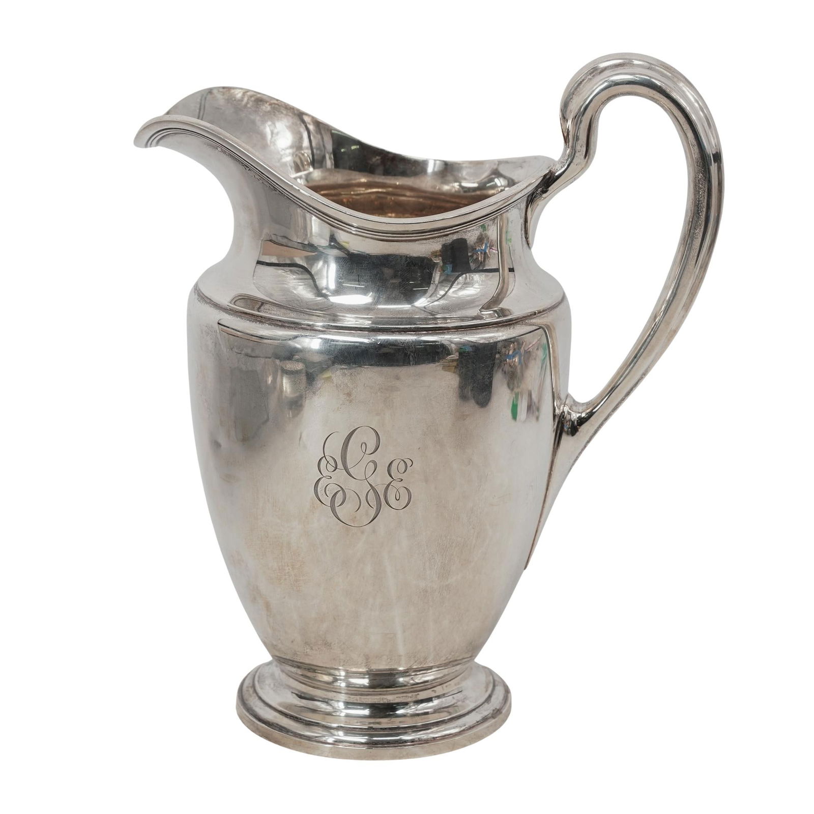 Tiffany & Co. Sterling Silver Pitcher: Tiffany & Co. Sterling Silver PitcherMid 20th Cent. USASterling silver pitcher with 4 1/2 pints capacity, of classical form, featuring a shaped pouring spout, curved handle, and stepped circular foot.