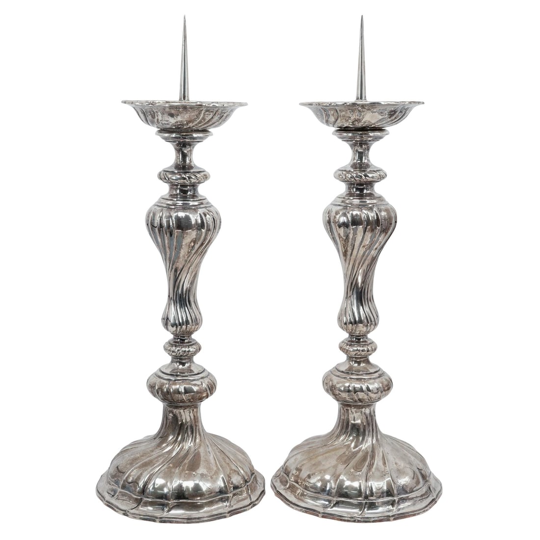 Antique Pair of German 800 Silver Candlesticks: Antique Pair of German 800 Silver Candlesticks20th century, GermanPair of German 800 Silver CandlesticksThey feature a twisted, fluted stem design and wide flared bases. The tops include a cup for a c