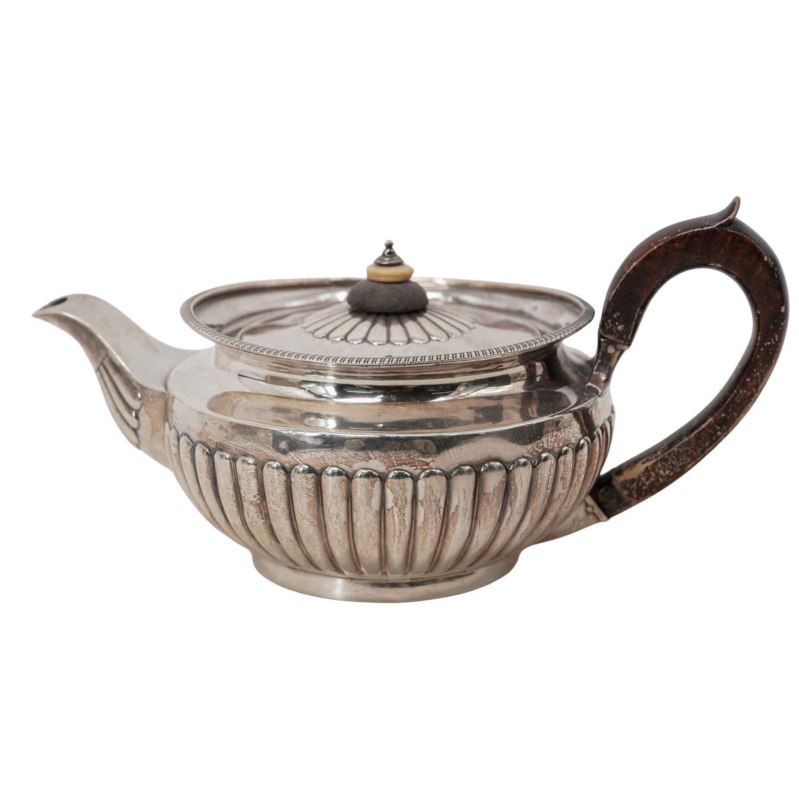 Victorian English Sterling Silver Tea Pot: Victorian English Sterling Silver Tea Pot Late 19th Cent., British Antique British sterling silver teapot featuring a fluted body and a dark wood handle, typical of Victorian styles popular during