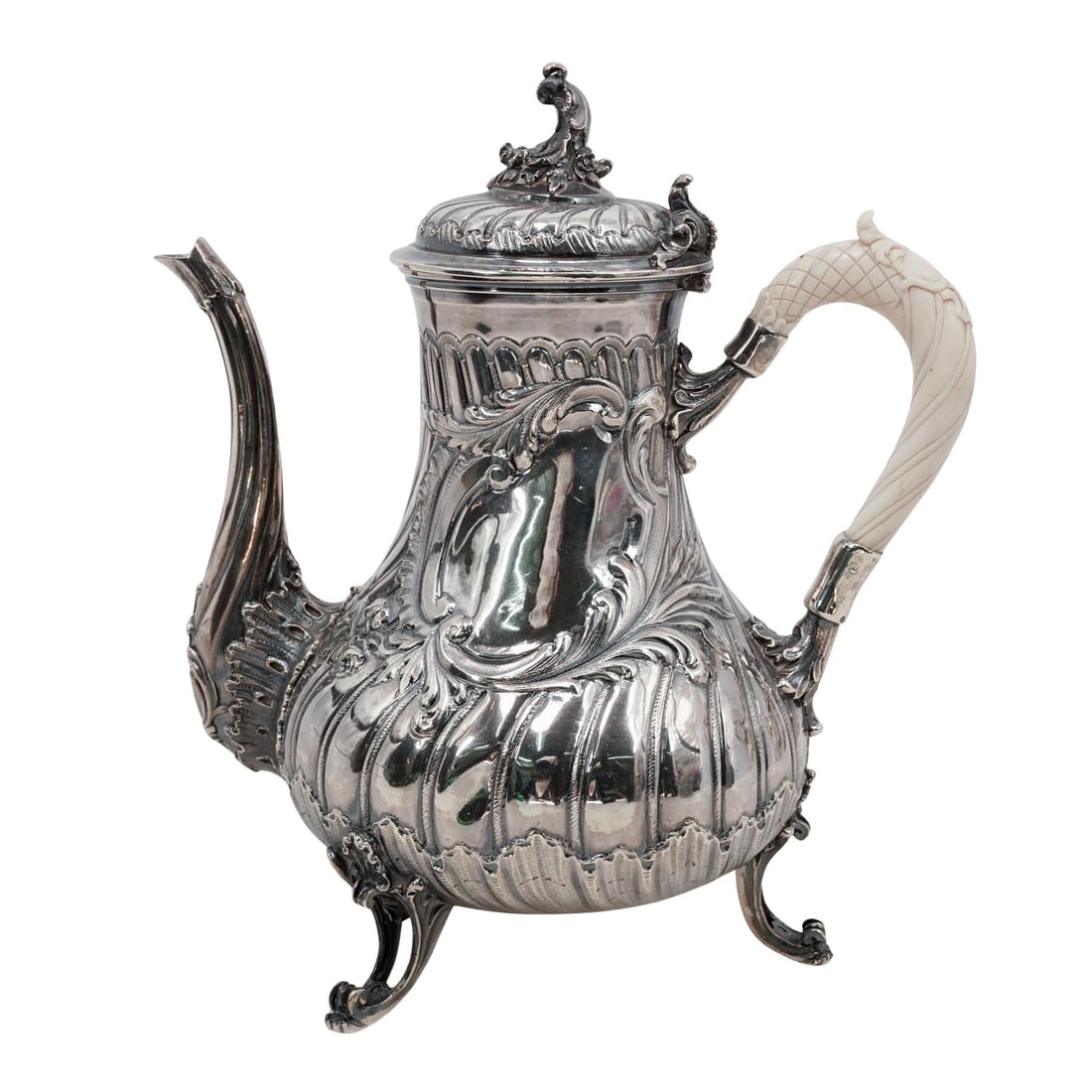 Antique French Rococo Sterling & Carved Bone Coffee Pot: Antique French Rococo Sterling & Carved Bone Coffee Pot Late 19th c., France Ornate Rococo sterling silver three-footed coffee pot featuring elaborate shell, scroll, and foliage decorations with a