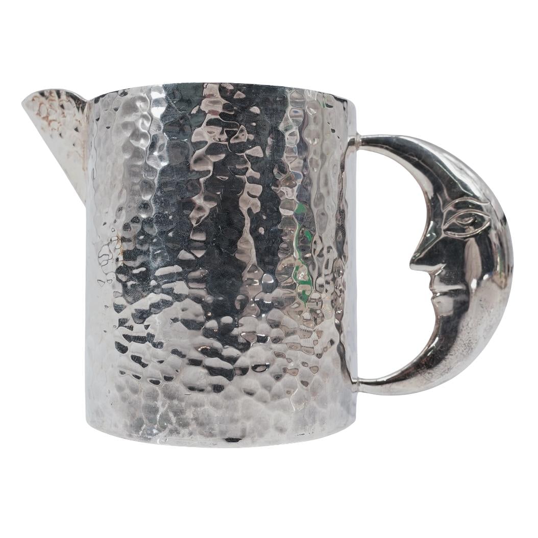 Los Castillo Mexican Sterling Silver Moon Creamer: Los Castillo Mexican Sterling Silver Moon CreamerMid to Late 20th c., MexicoHammered sterling silver creamer or small pitcher featuring a crescent moon-shaped handle. It is hallmarked "Los Castillo Ta
