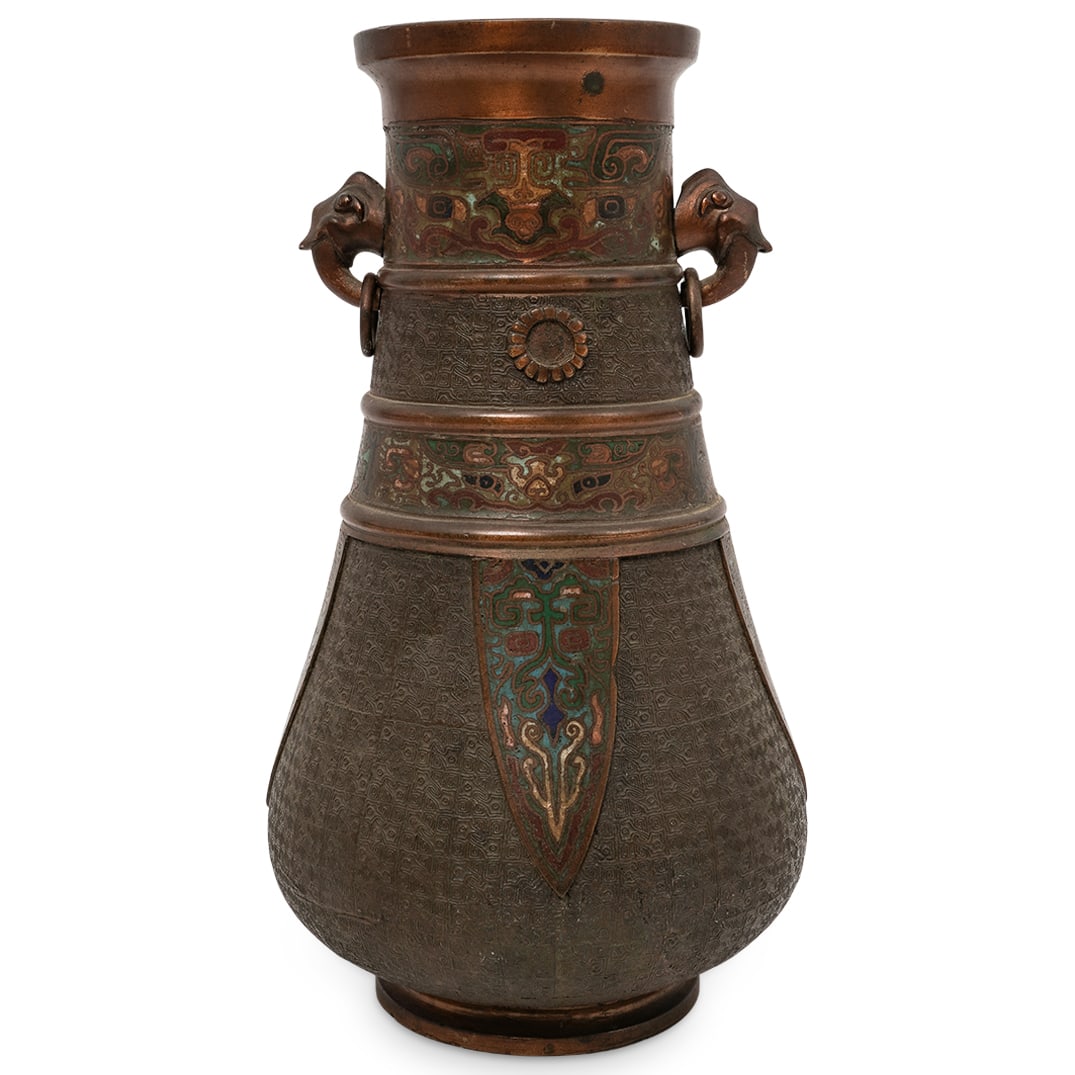 Japanese Meiji-Taisho Champleve Ritual Ewer: Japanese Meiji-Taisho Champleve Ritual Ewer Late 19th to early 20th Cent., Japan Japanese Champlevé bronze ewer decorated with polychrome enamel, featuring a flared rim, and applied ring handles.