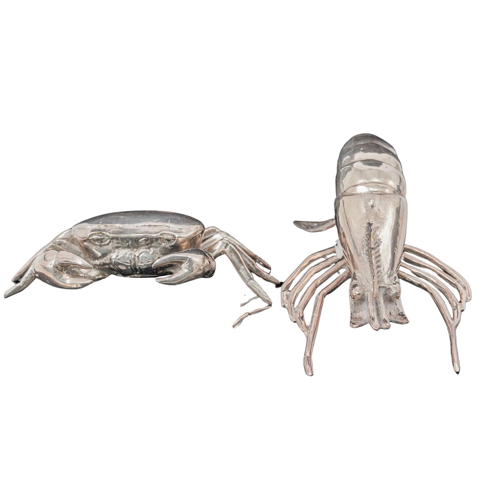 (2pc) Silver Plated Crustaceans Figurines: (2pc) Silver Plated Crustaceans FigurinesMid 20th Cent.Pair of mid-20th century silver plated figural crustaceans, modeled as a lobster and a crab, finely cast with naturalistic detail. Designed as de