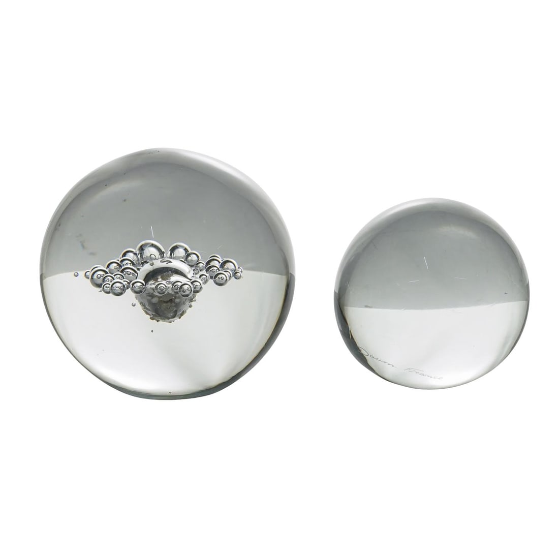 (2 Pc) Daum Clear Art Glass Large Paperweights: (2 Pc) Daum Clear Art Glass Large Paperweights 20th century, French (2 Pc) Daum Clear Art Glass Large Paperweights The Paperweights feature prismatic design that reflects light and creates rainbow