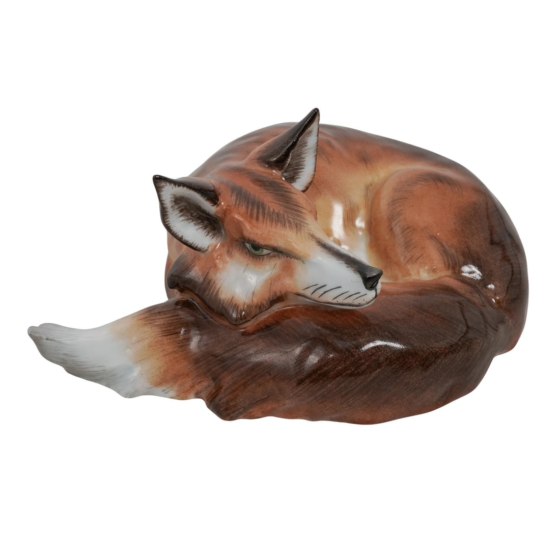 Herend Porcelain Fox Figurine: Herend Porcelain Fox Figurine20th c., HungaryRare porcelain natural fox lying down figurine hand-painted in layered black, brown, and white tones with subtle shading for a realistic effect. Model numb